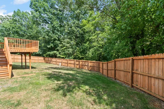 a view of a deck with a fence