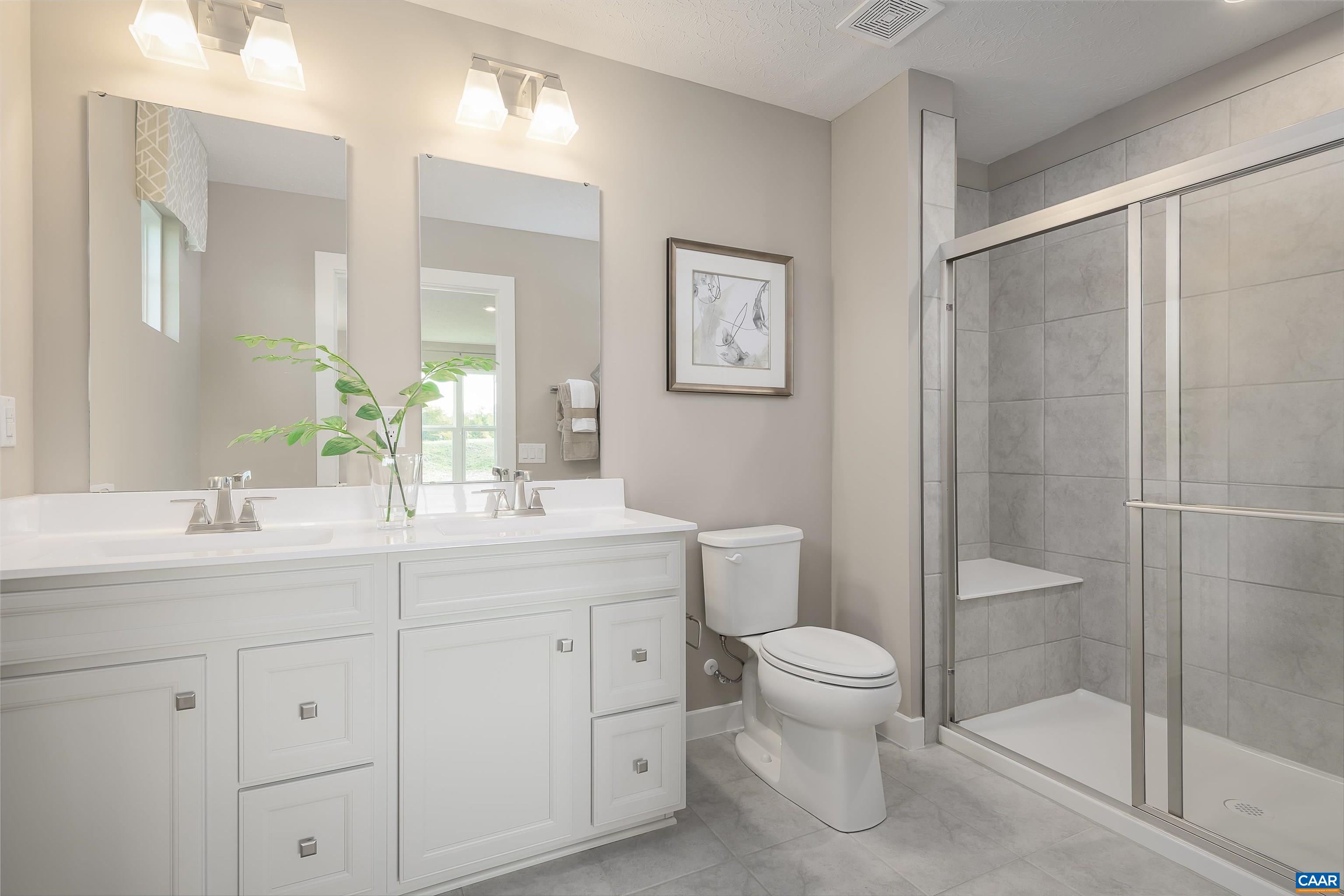 5137 Lazy Branch Lane Keswick, VA 22947 - Photo 8 of 13 a bathroom with a sink a toilet and shower