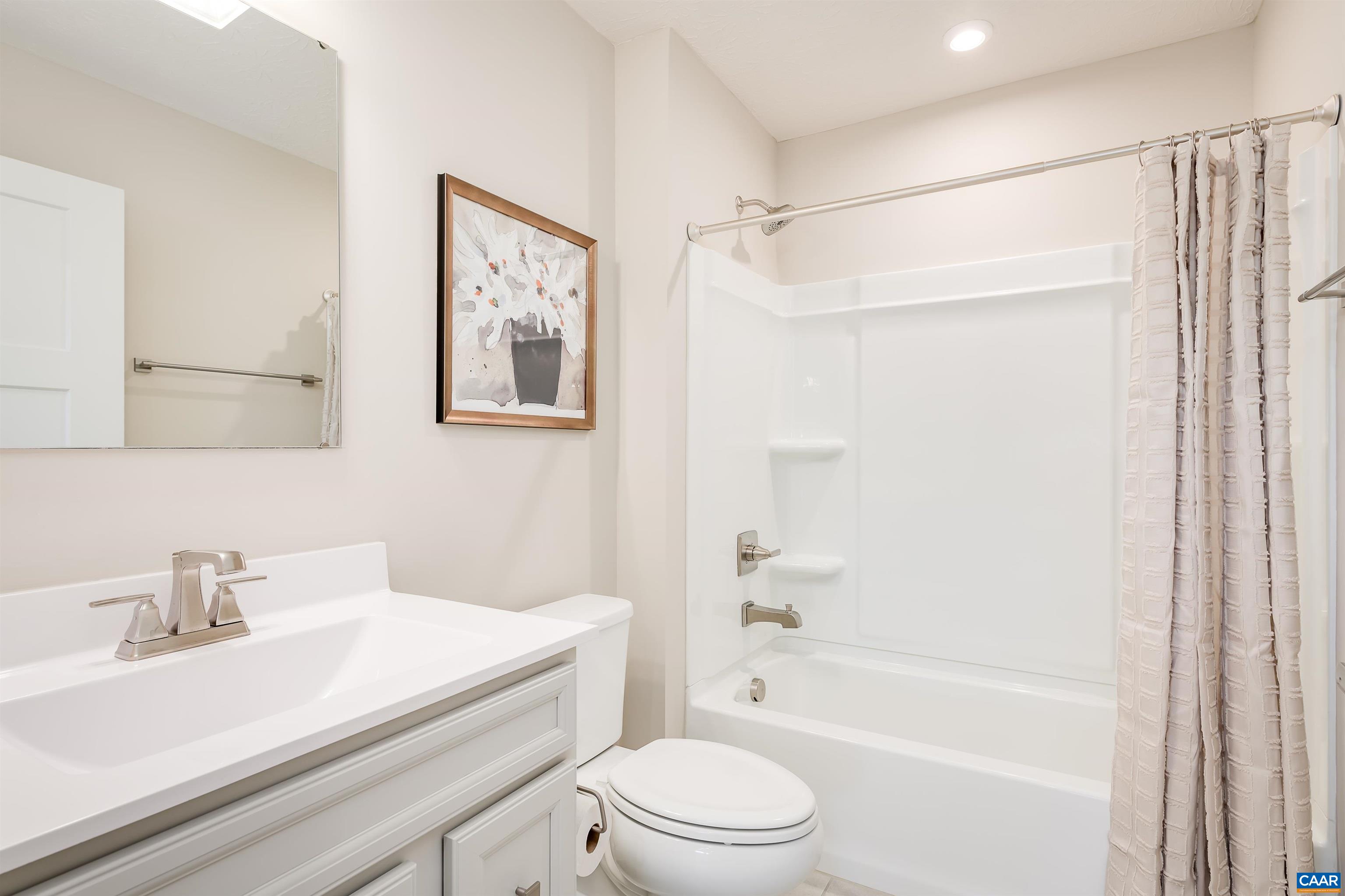 5137 Lazy Branch Lane Keswick, VA 22947 - Photo 10 of 13 a bathroom with a sink a toilet and a bathtub
