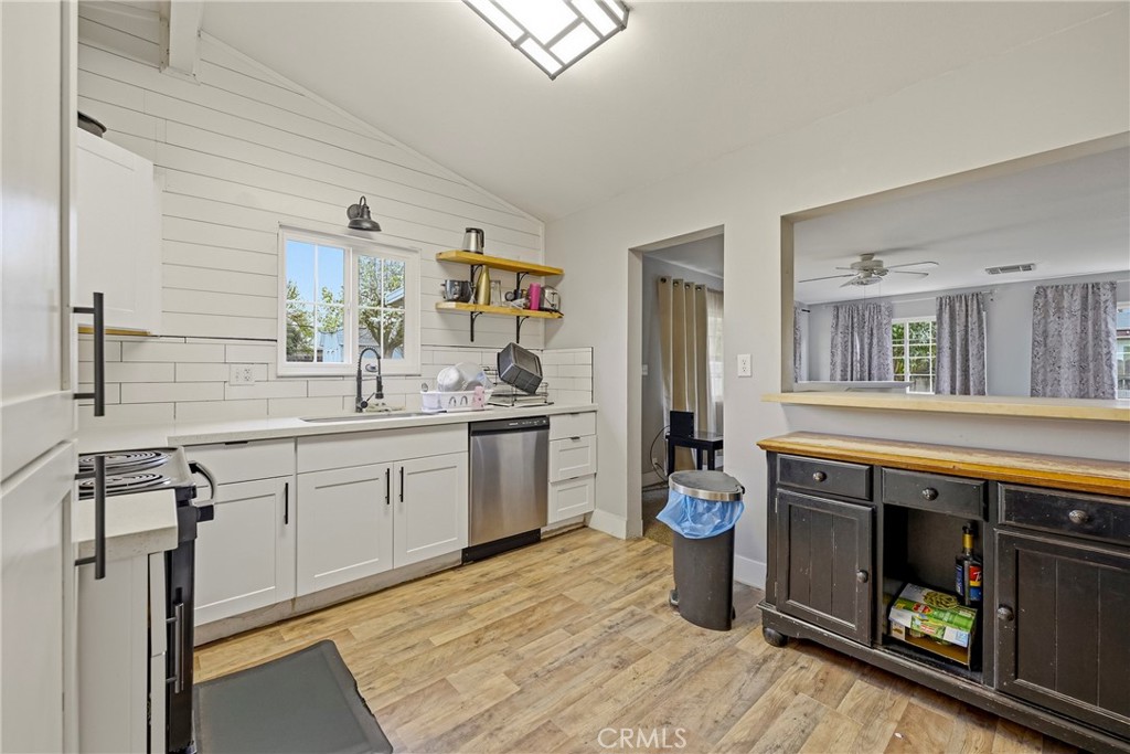 2690 Hawthorne Avenue Merced, CA 95340 - Photo 15 of 36 a kitchen with a sink stove and cabinets