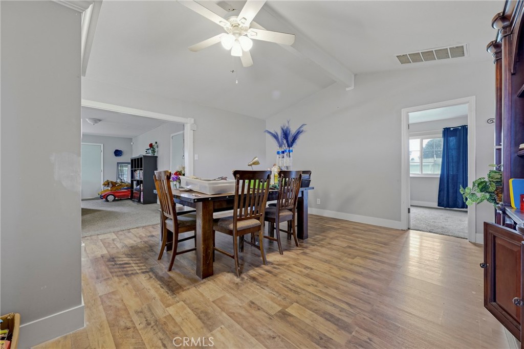 2690 Hawthorne Avenue Merced, CA 95340 - Photo 21 of 36 a view of a dining room with furniture and wooden floor
