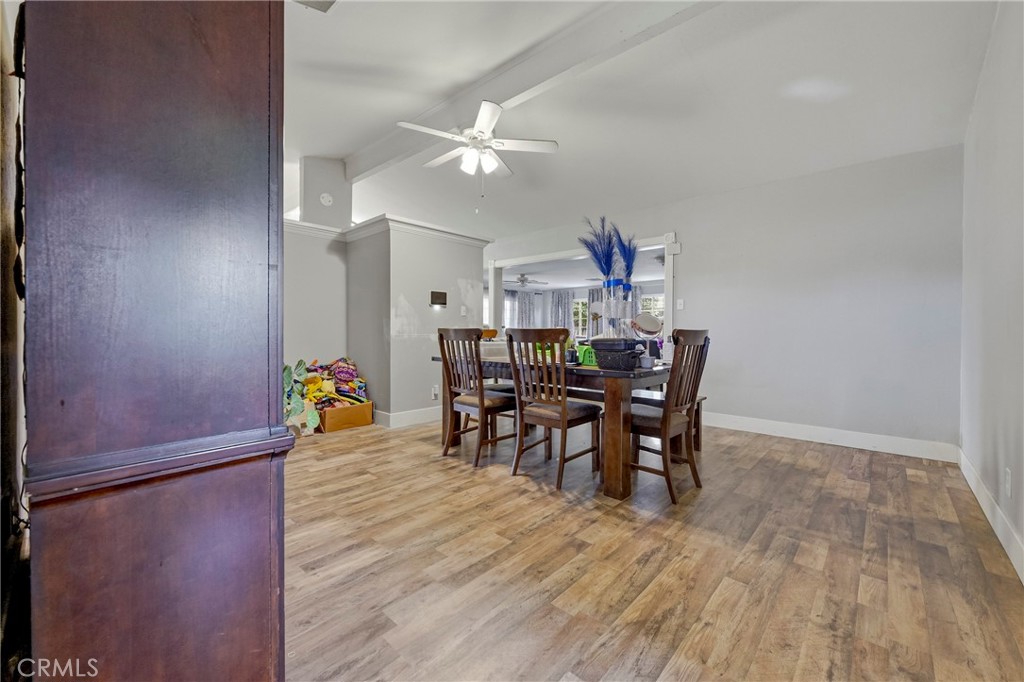 2690 Hawthorne Avenue Merced, CA 95340 - Photo 22 of 36 a view of a dining room with furniture and wooden floor