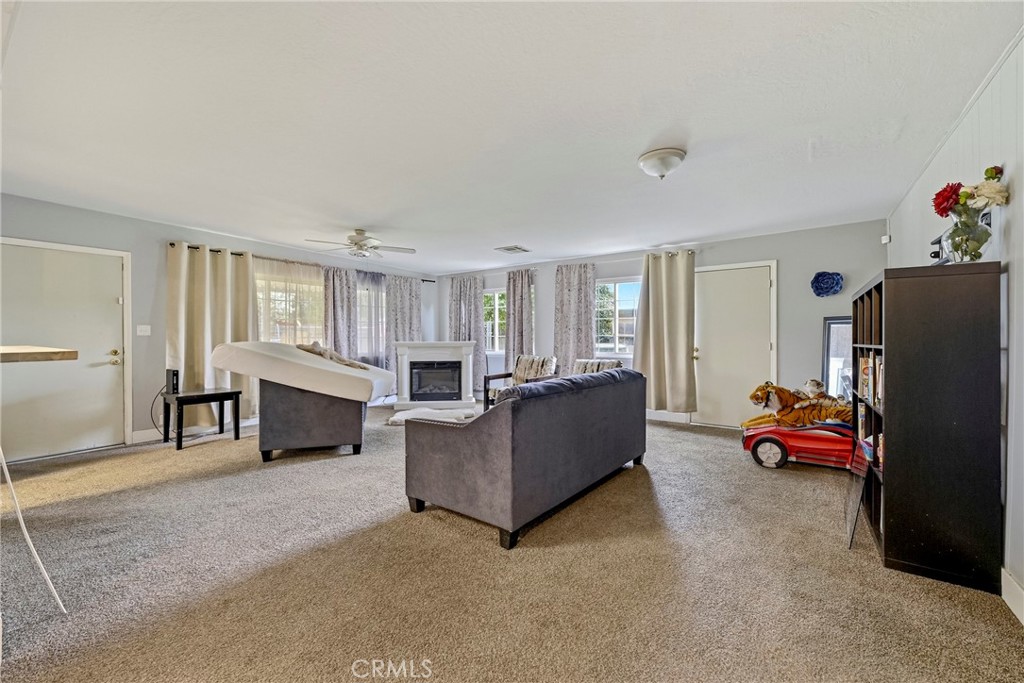 2690 Hawthorne Avenue Merced, CA 95340 - Photo 23 of 36 a living room with furniture and a refrigerator
