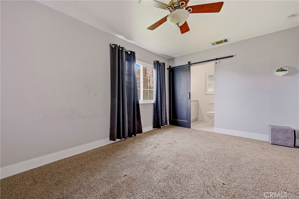 2690 Hawthorne Avenue Merced, CA 95340 - Photo 24 of 36 a view of a livingroom with a ceiling fan and window