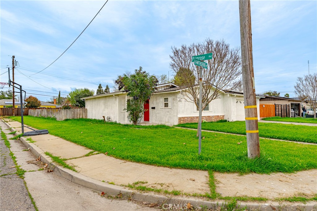 2690 Hawthorne Avenue Merced, CA 95340 - Photo 31 of 36 a view of a white house with a big yard and potted plants