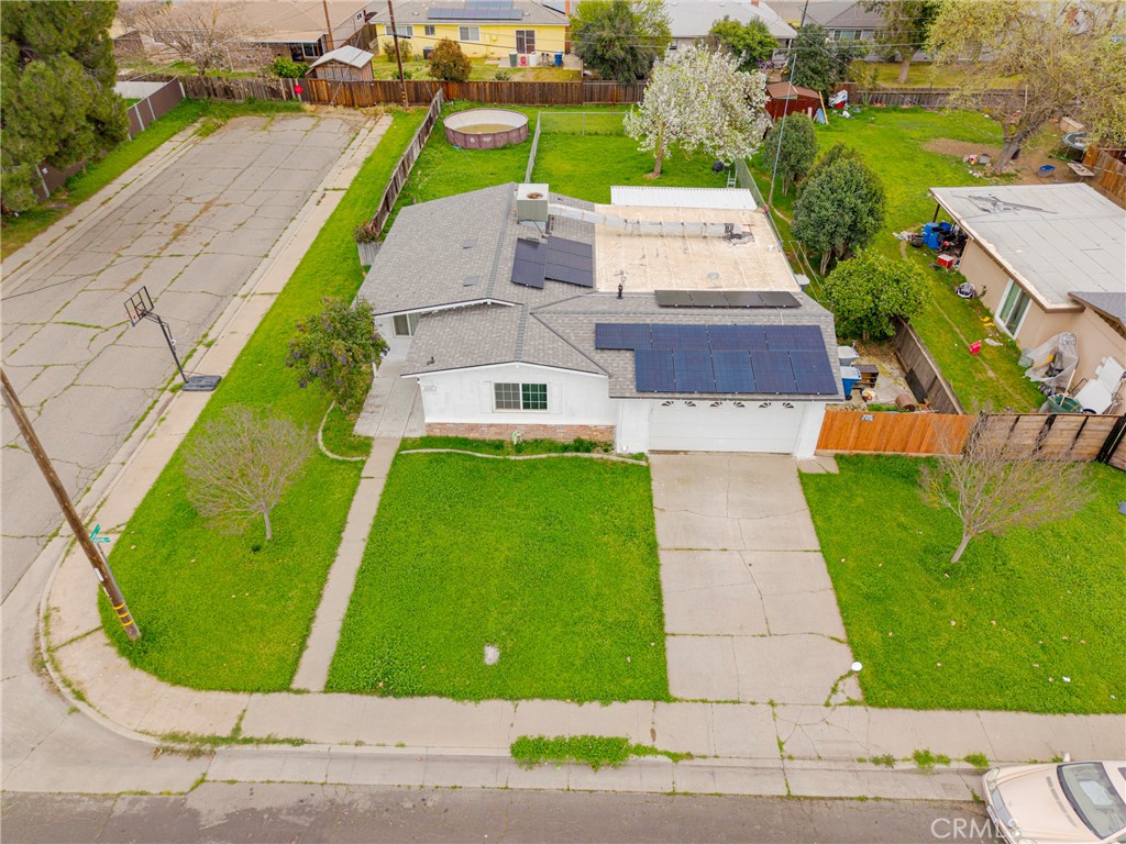 2690 Hawthorne Avenue Merced, CA 95340 - Photo 9 of 36 an aerial view of a house with a garden and swimming pool