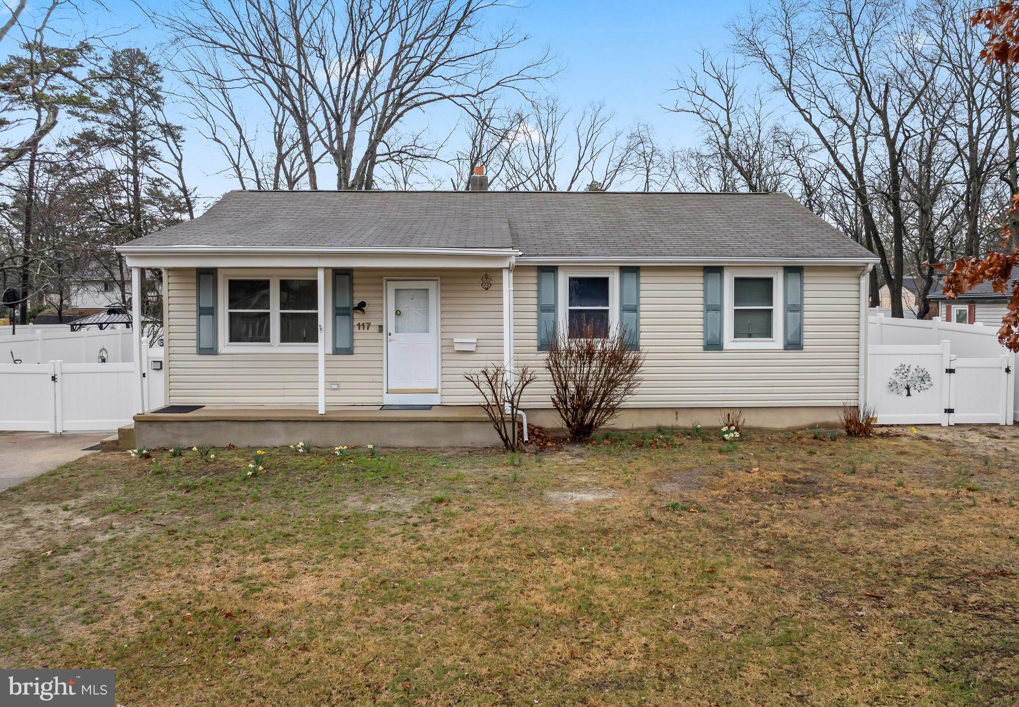 a backyard of a house with yard and barbeque oven