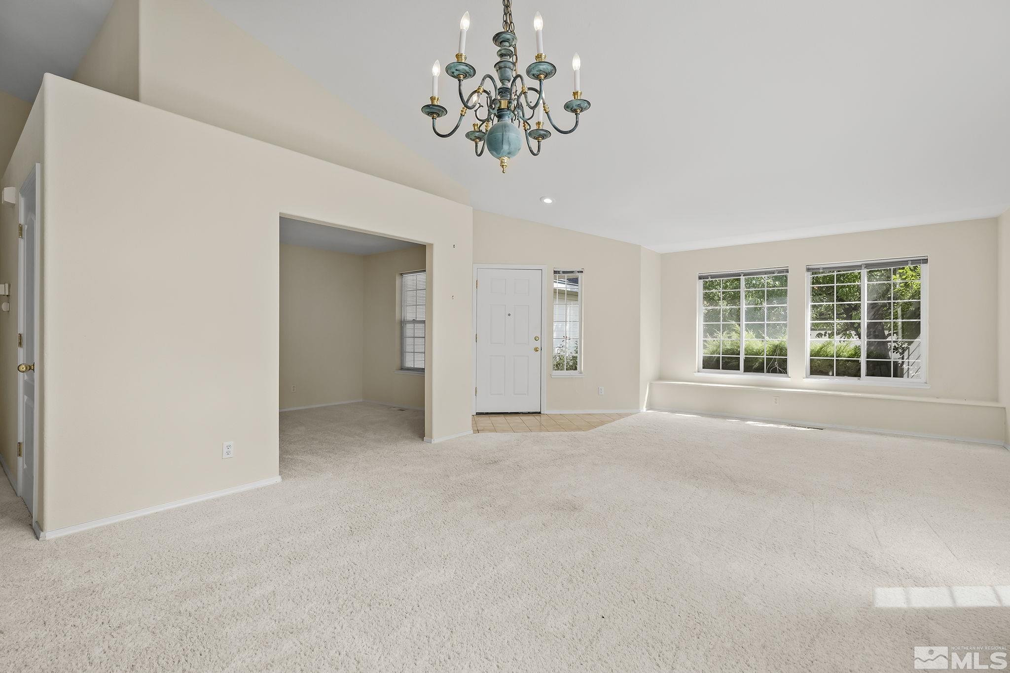 5875 Simons Drive Reno, NV 89523 - Photo 4 of 26 a view of an empty room with a window