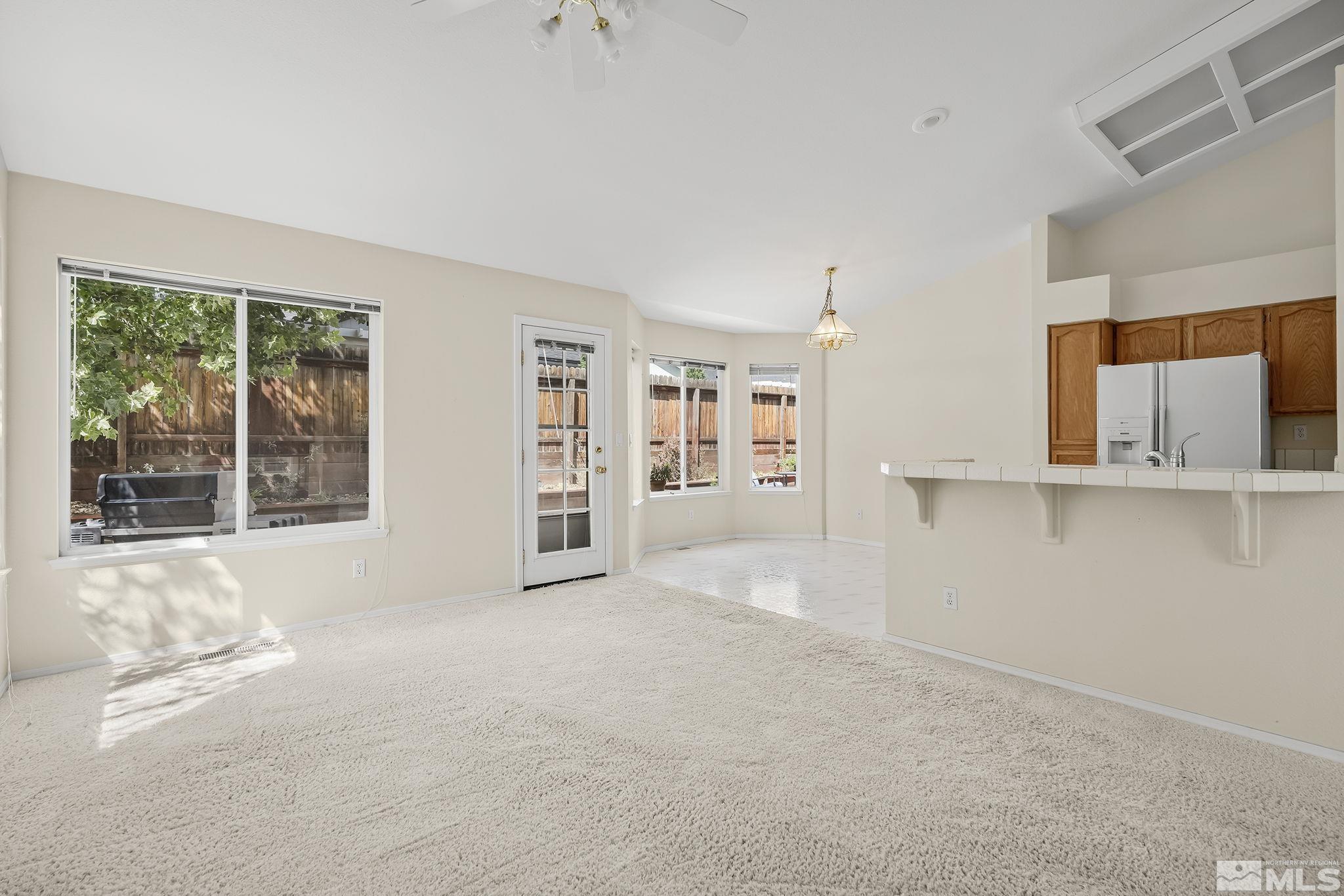 5875 Simons Drive Reno, NV 89523 - Photo 9 of 26 a view of an empty room with a window