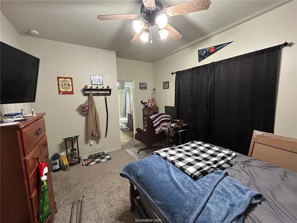 a bathroom with a sink a toilet a mirror and tub