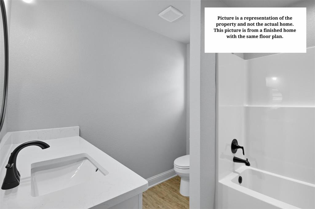 7635 Hudson Way Abilene, TX 79602 - Photo 15 of 17 a bathroom with a sink and a bathtub