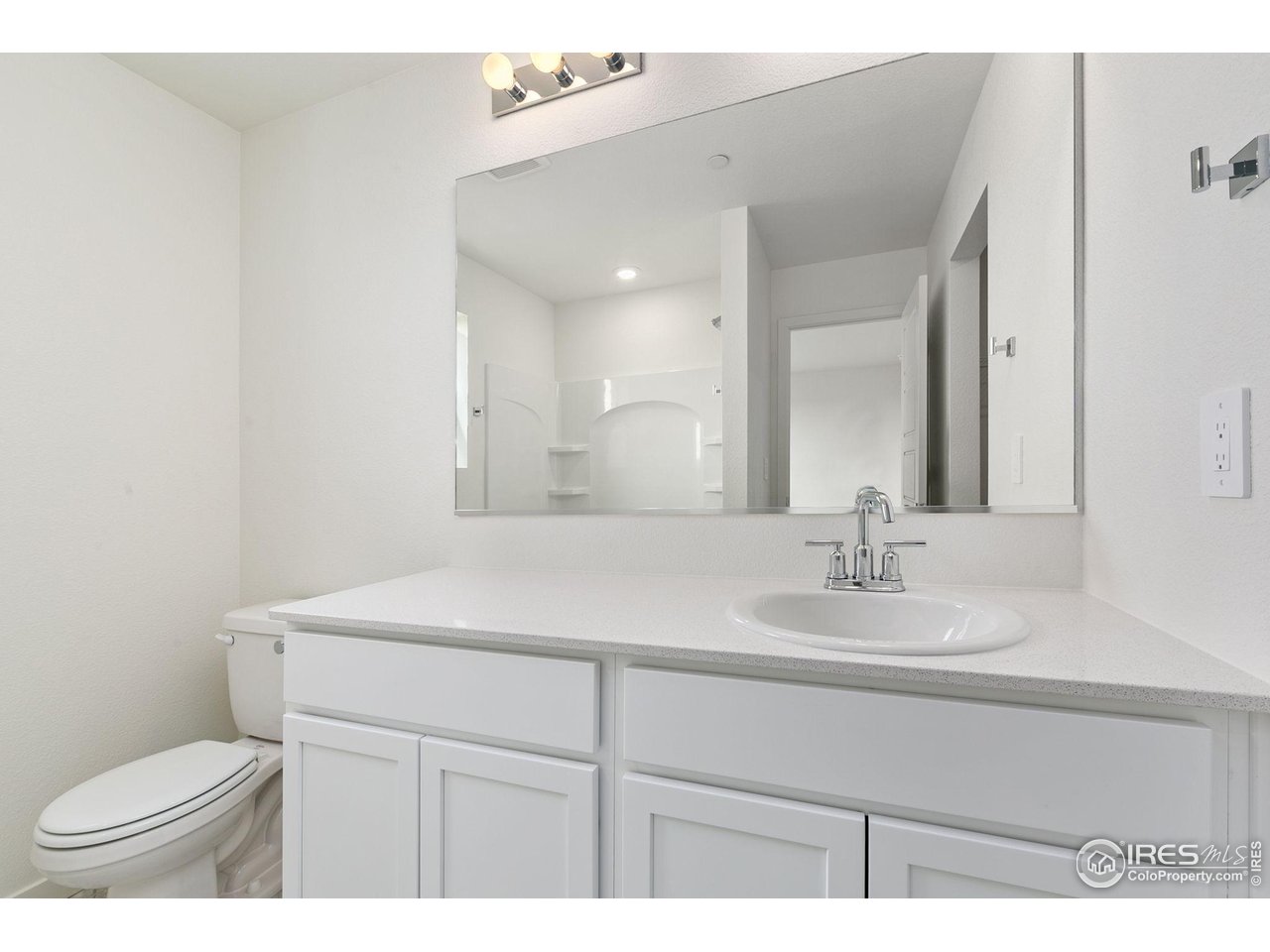 417 Condor Way Johnstown, CO 80534 - Photo 6 of 11 a bathroom with a sink toilet and mirror
