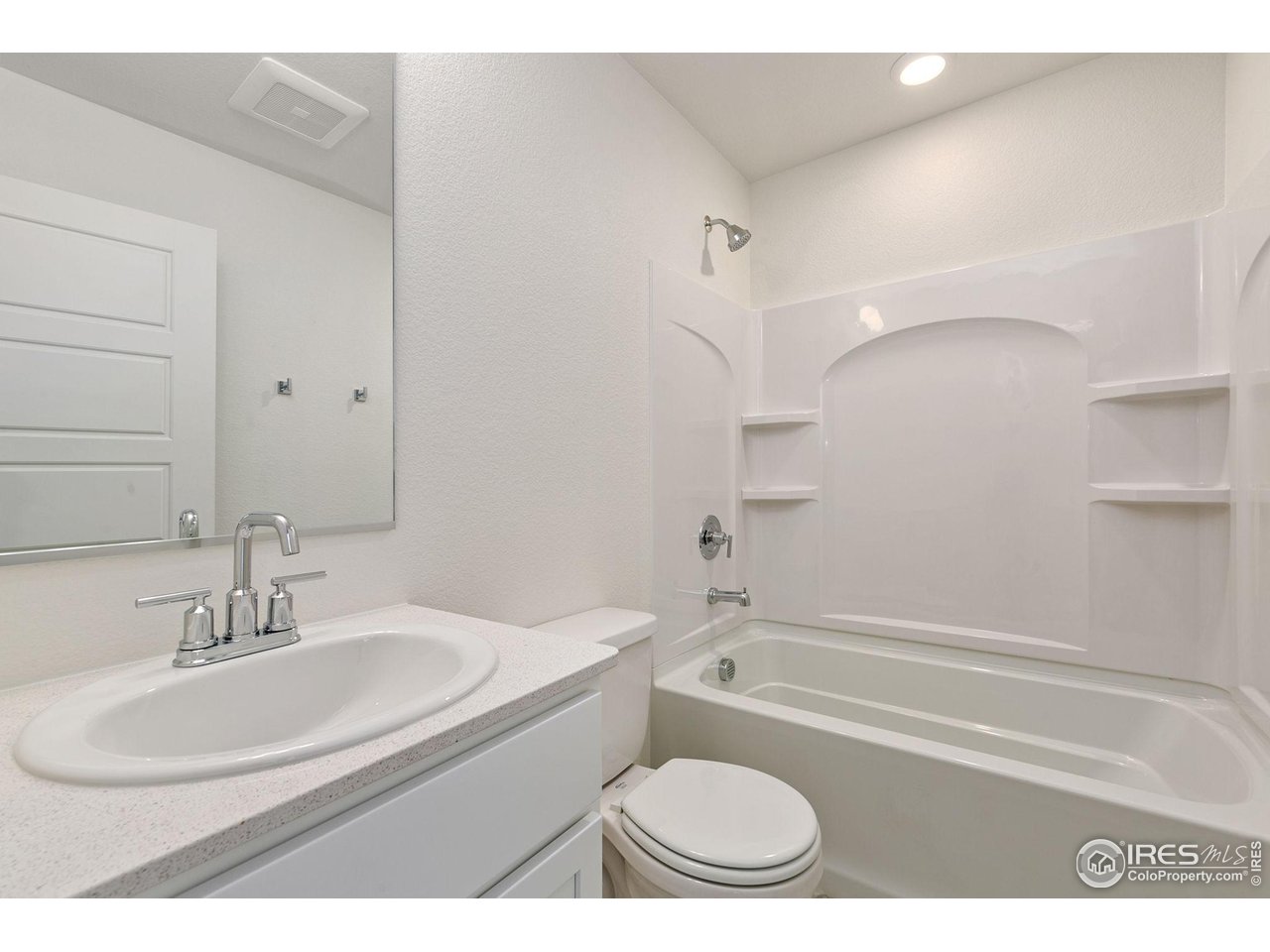 417 Condor Way Johnstown, CO 80534 - Photo 9 of 11 a bathroom with a sink toilet a bathtub and a vanity