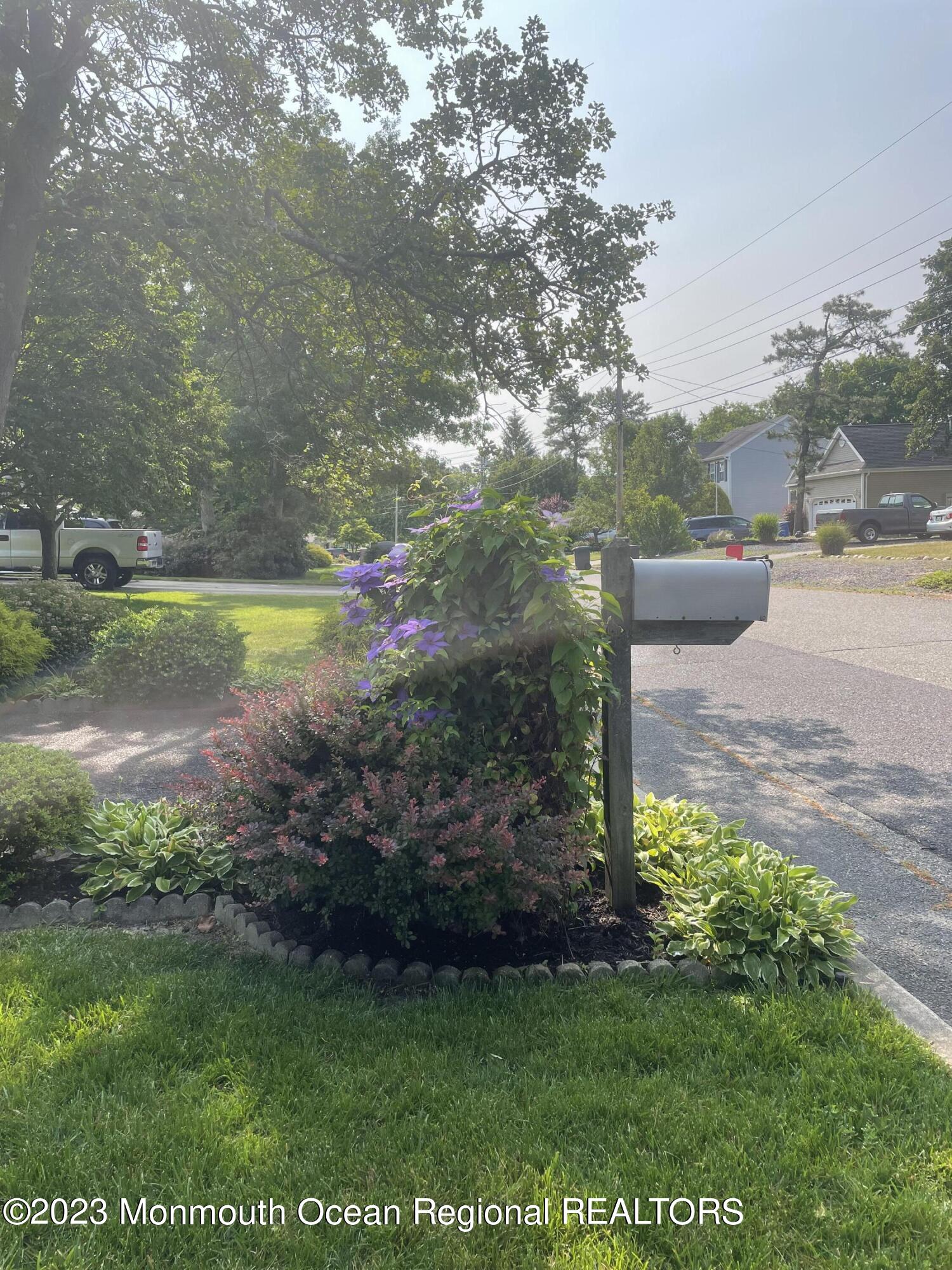 216 Wave Road Manahawkin, NJ 08050 - Photo 3 of 30 a view of a back yard of the house