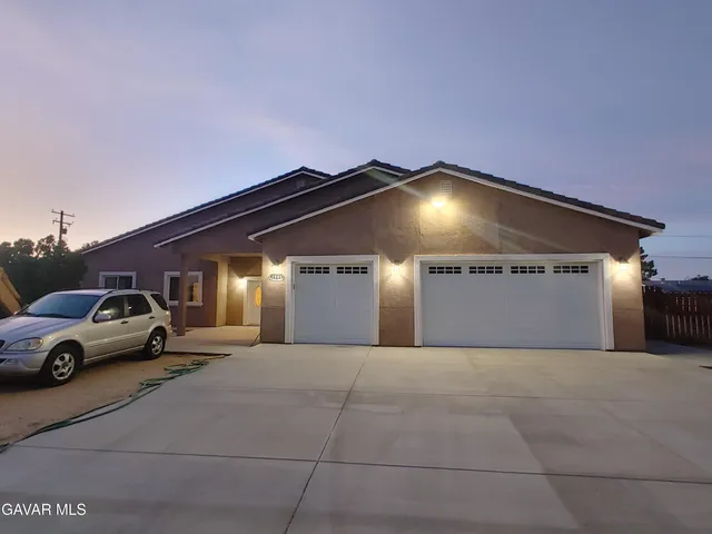 a front view of a house with a outdoor space