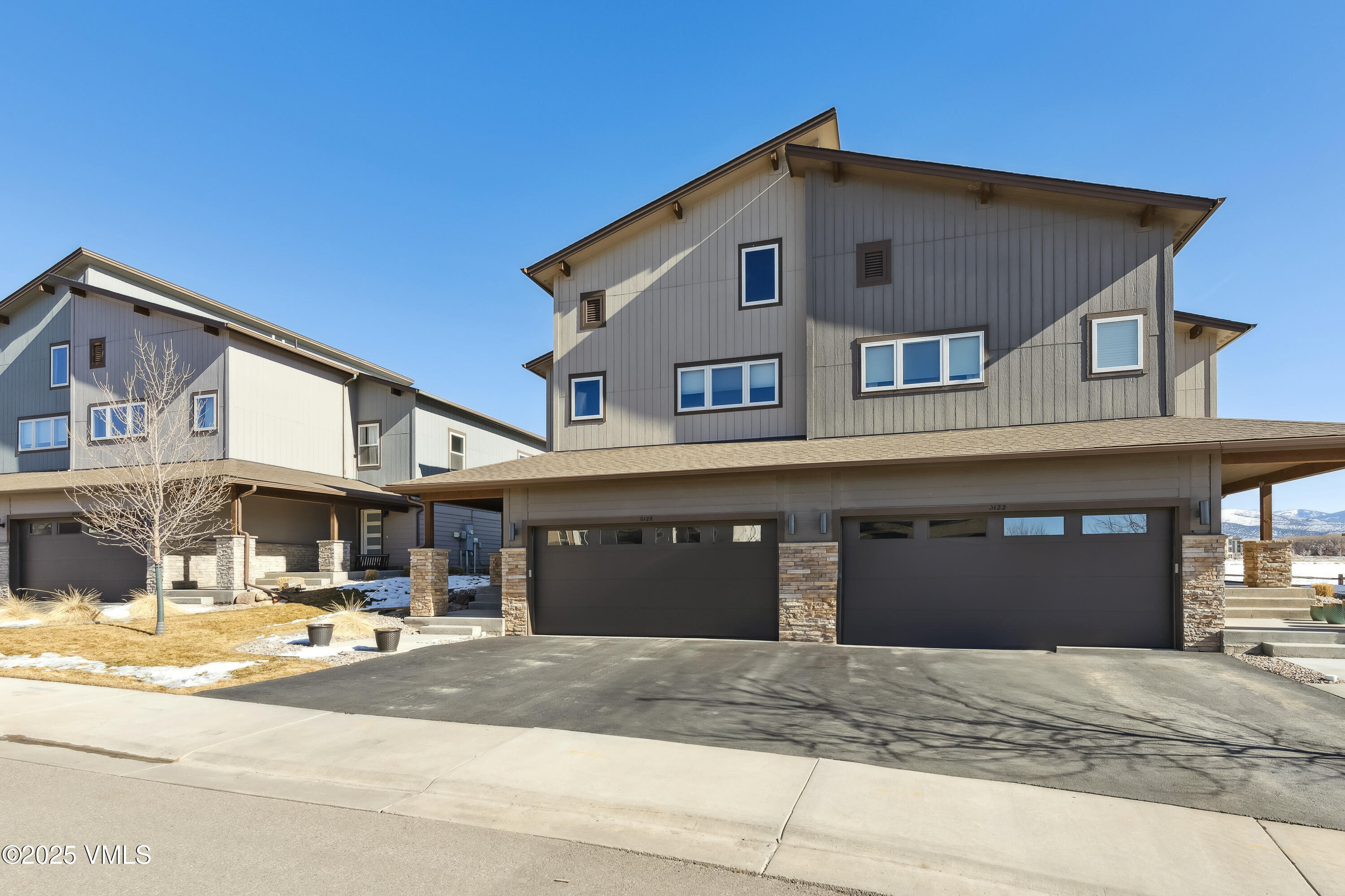 128 Soleil Circle Eagle, CO 81631 - Photo 2 of 42 a front view of a house with a yard