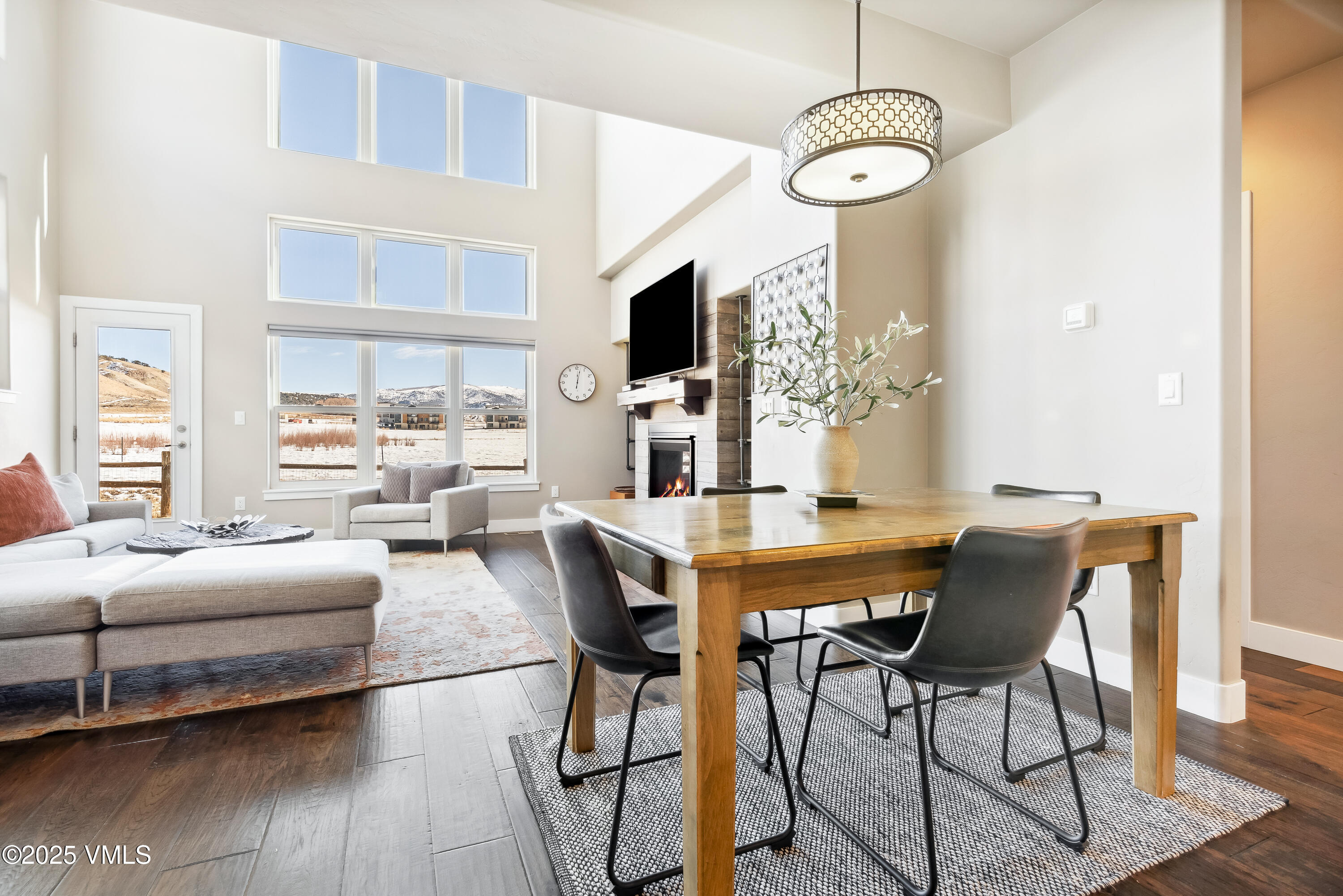 128 Soleil Circle Eagle, CO 81631 - Photo 6 of 42 a view of a dining room with furniture window and wooden floor