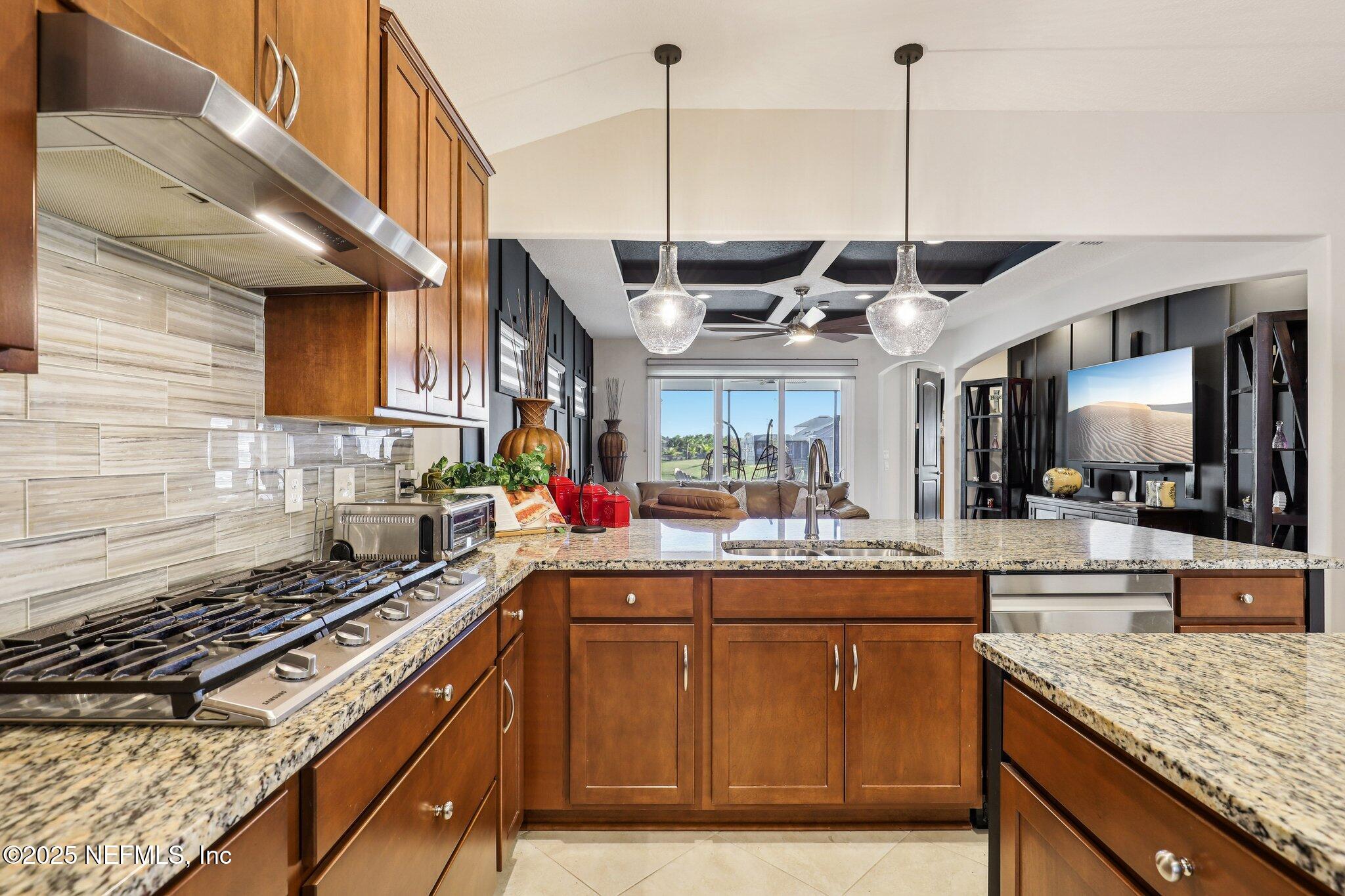 48 Fawn Field Lane St. Augustine, FL 32092 - Photo 17 of 73 a kitchen with stainless steel appliances granite countertop a sink counter space cabinets and stove