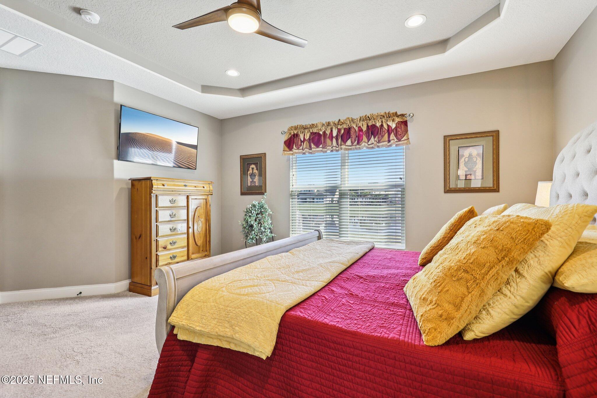 48 Fawn Field Lane St. Augustine, FL 32092 - Photo 24 of 73 a bed sitting in a bedroom next to a window