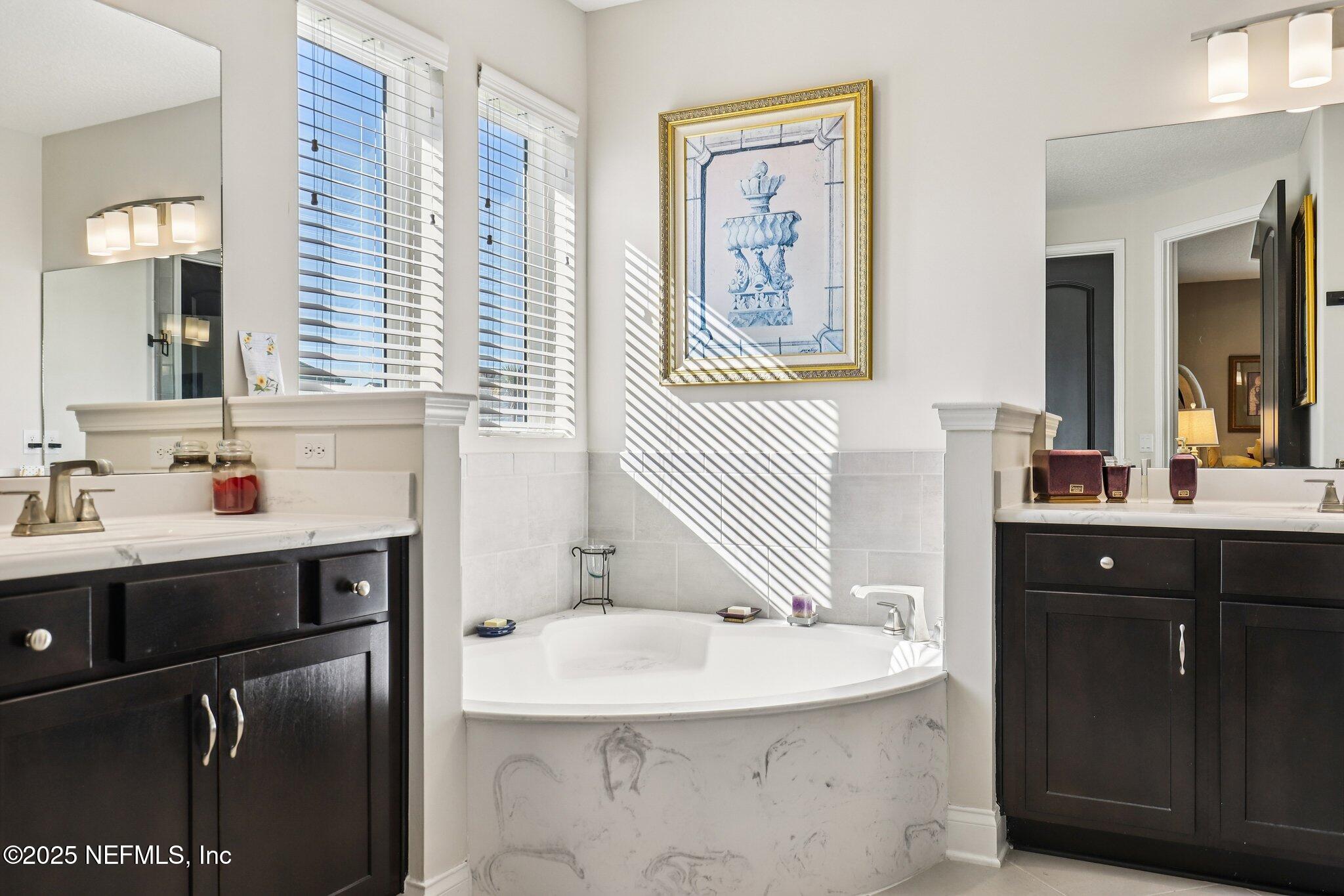 48 Fawn Field Lane St. Augustine, FL 32092 - Photo 27 of 73 a bathroom with a sink and a mirror