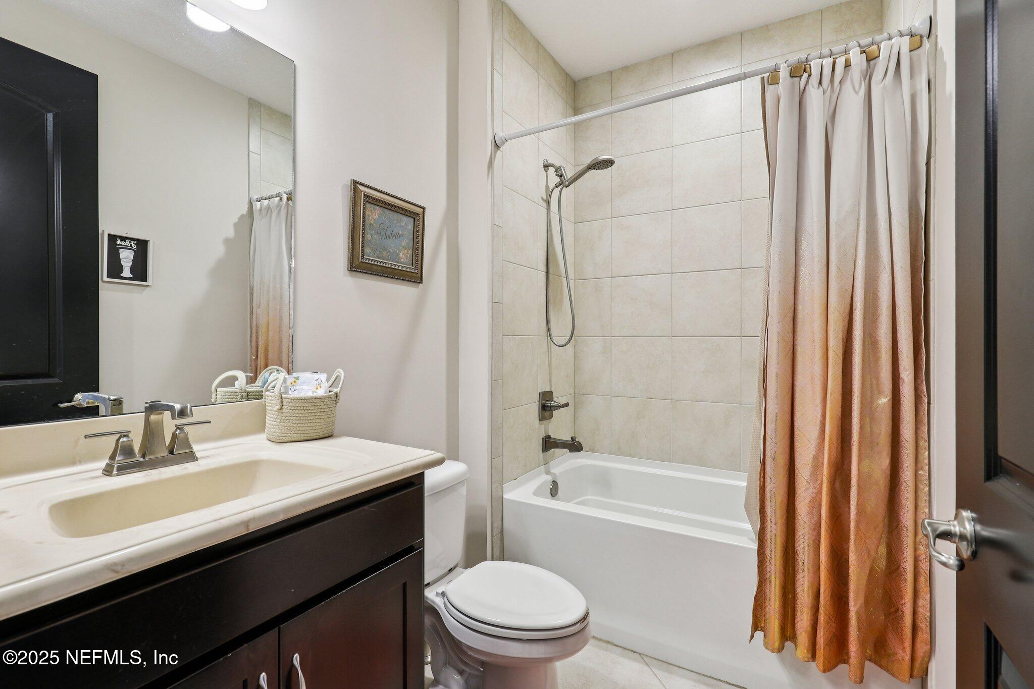 48 Fawn Field Lane St. Augustine, FL 32092 - Photo 33 of 73 a bathroom with a sink a toilet and shower