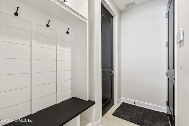 an aerial view of a residential houses with outdoor space