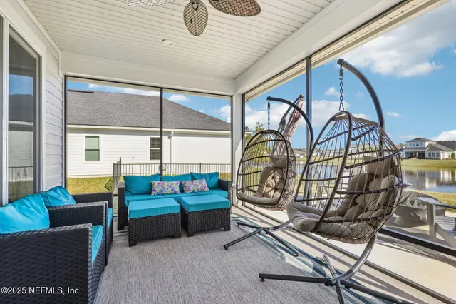a view of a house with swimming pool and sitting area