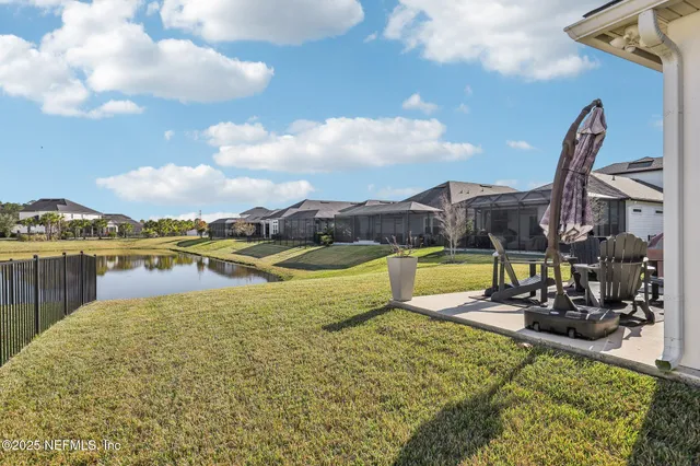 an aerial view of a house with a swimming pool