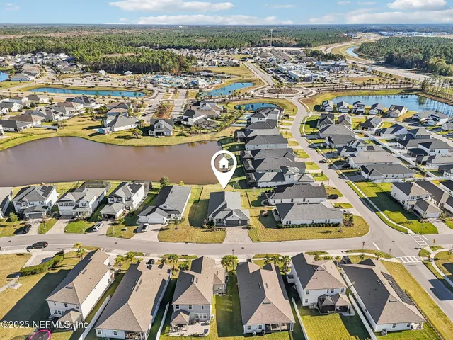a view of a lake with a table and chairs