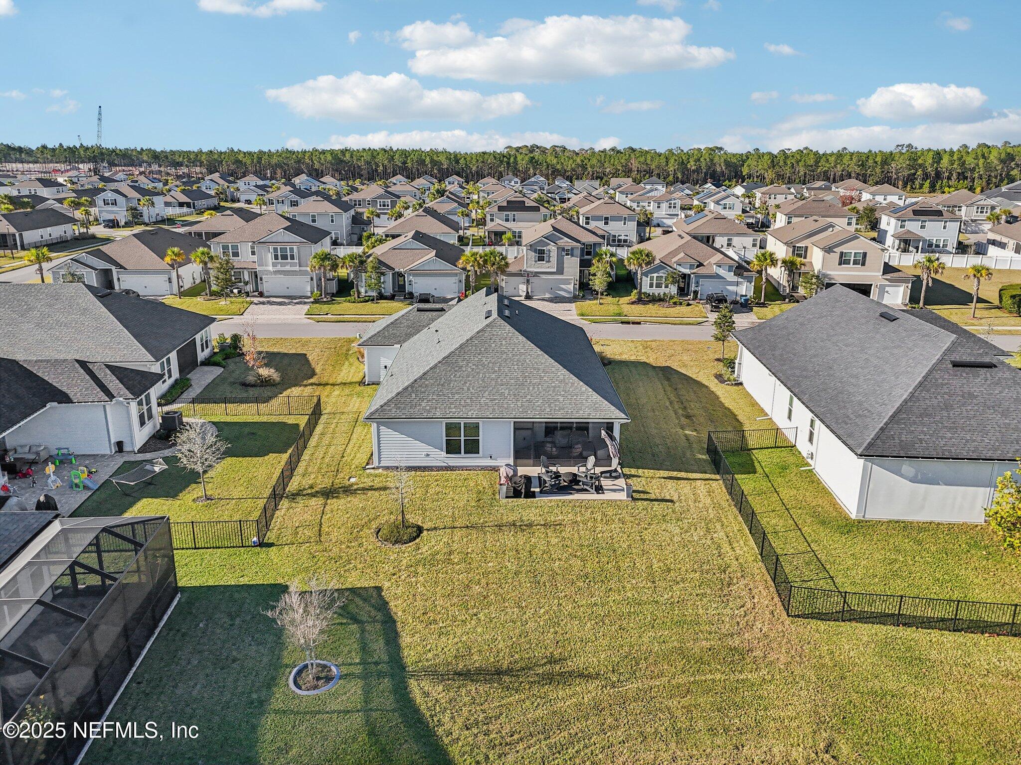 48 Fawn Field Lane St. Augustine, FL 32092 - Photo 48 of 73 an aerial view of a house with a swimming pool