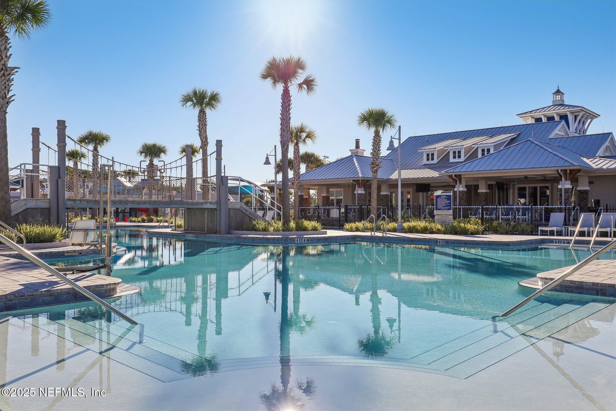 48 Fawn Field Lane St. Augustine, FL 32092 - Photo 59 of 73 a view of a lake with a table and chairs