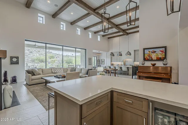 a living room with furniture a window and a fireplace