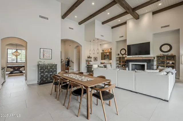 a spacious bedroom with a bed and a wooden floor