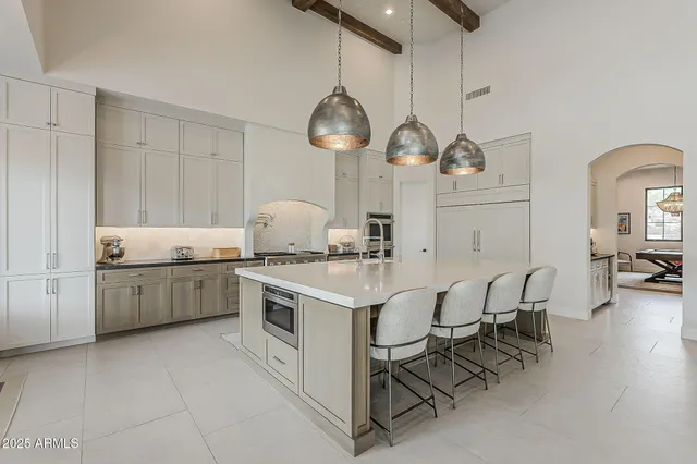 a bedroom with a bed and a table