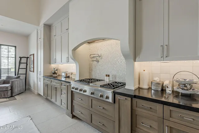 a bathroom with a double vanity sink a mirror and a bathtub