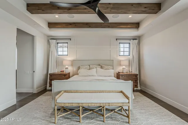 a bedroom with furniture and a window