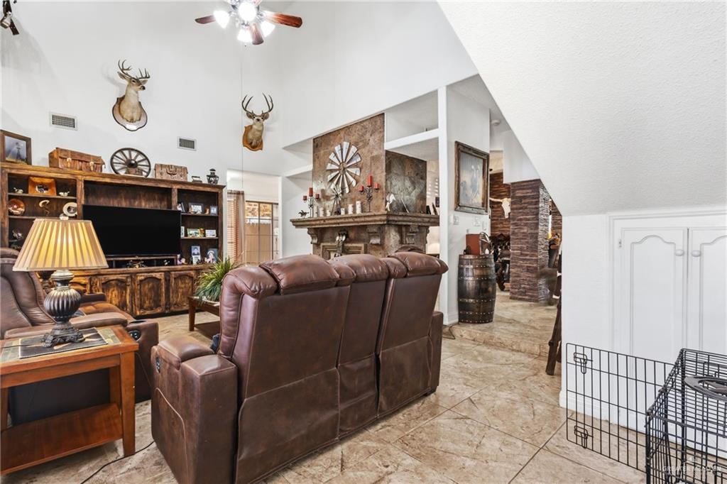 301 Cardinal Avenue McAllen, TX 78504 - Photo 4 of 17 a living room with furniture and a flat screen tv