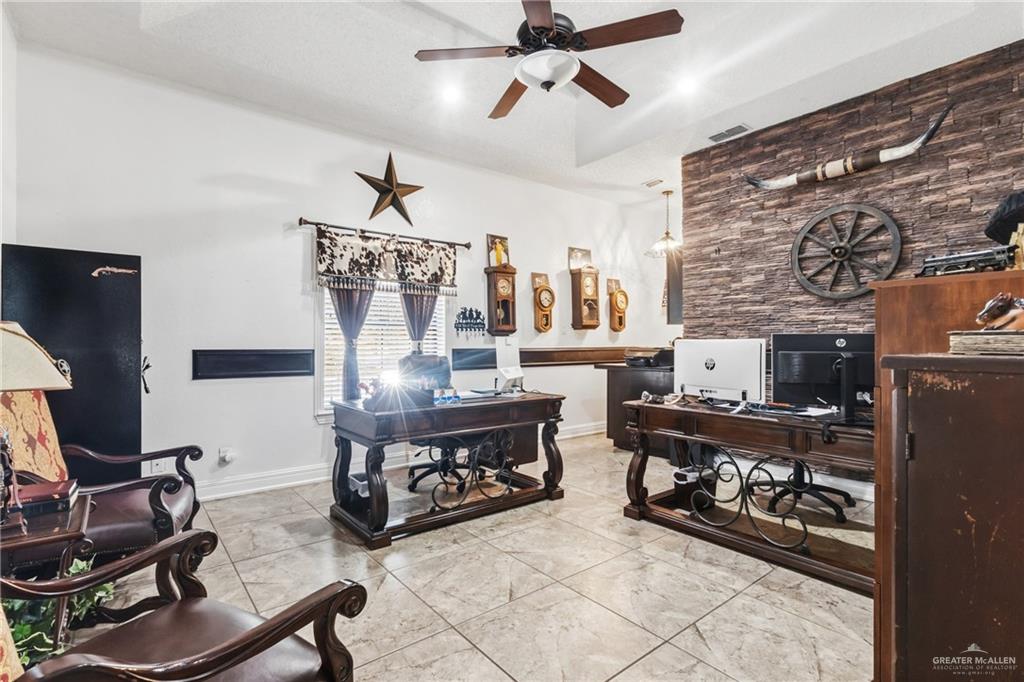 301 Cardinal Avenue McAllen, TX 78504 - Photo 9 of 17 a living room with furniture and a fireplace