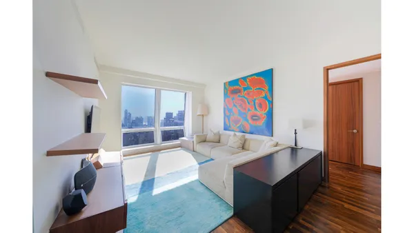 a living room with furniture and window