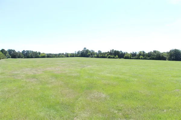 a view of a field with an outdoor space