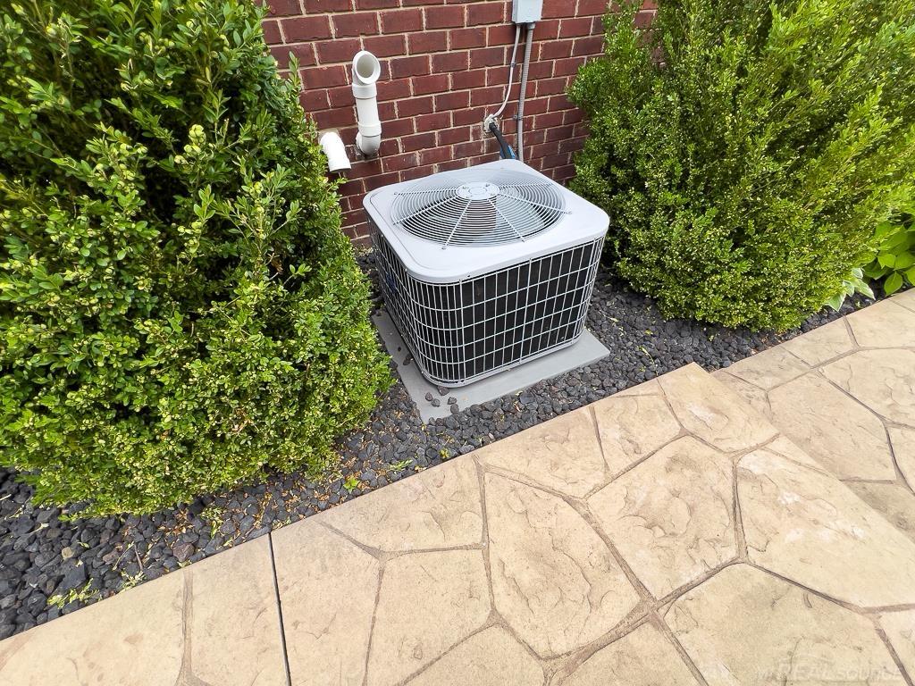 16070 Moore Park Road Macomb, MI 48044 - Photo 64 of 76 The central air unit is located on the side of the house so as not to disturb the peacefulness of the rear yard. It connects to the 90+ efficiency furnace.