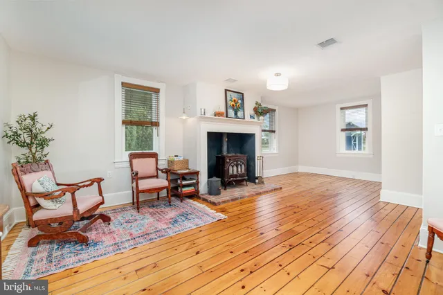 a view of a livingroom with furniture and a fireplace