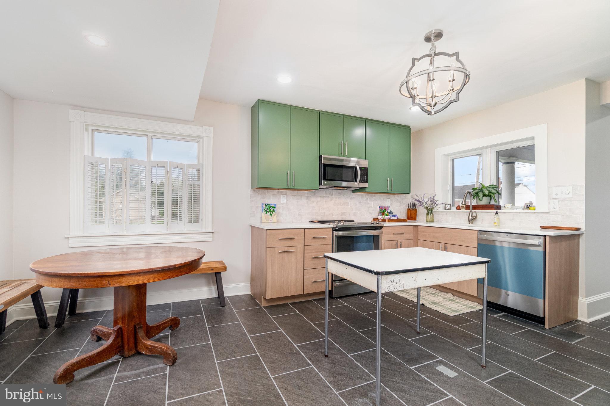 1103 Graystone Road Manheim, PA 17545 - Photo 8 of 24 a room with a dining table chairs and view kitchen