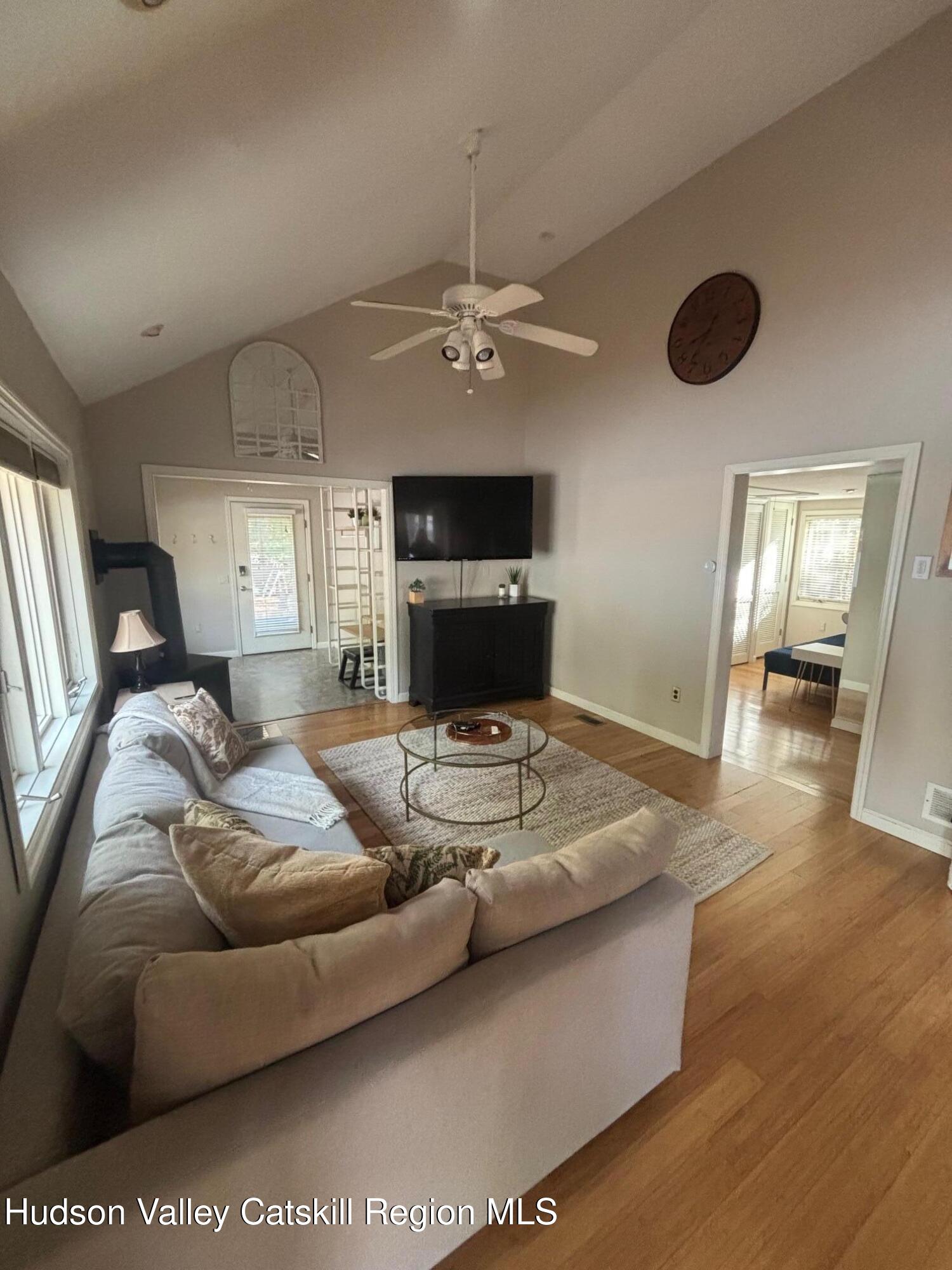 419 Southwest Colony Road Hillsdale, NY 12529 - Photo 4 of 10 a living room with furniture and a fireplace