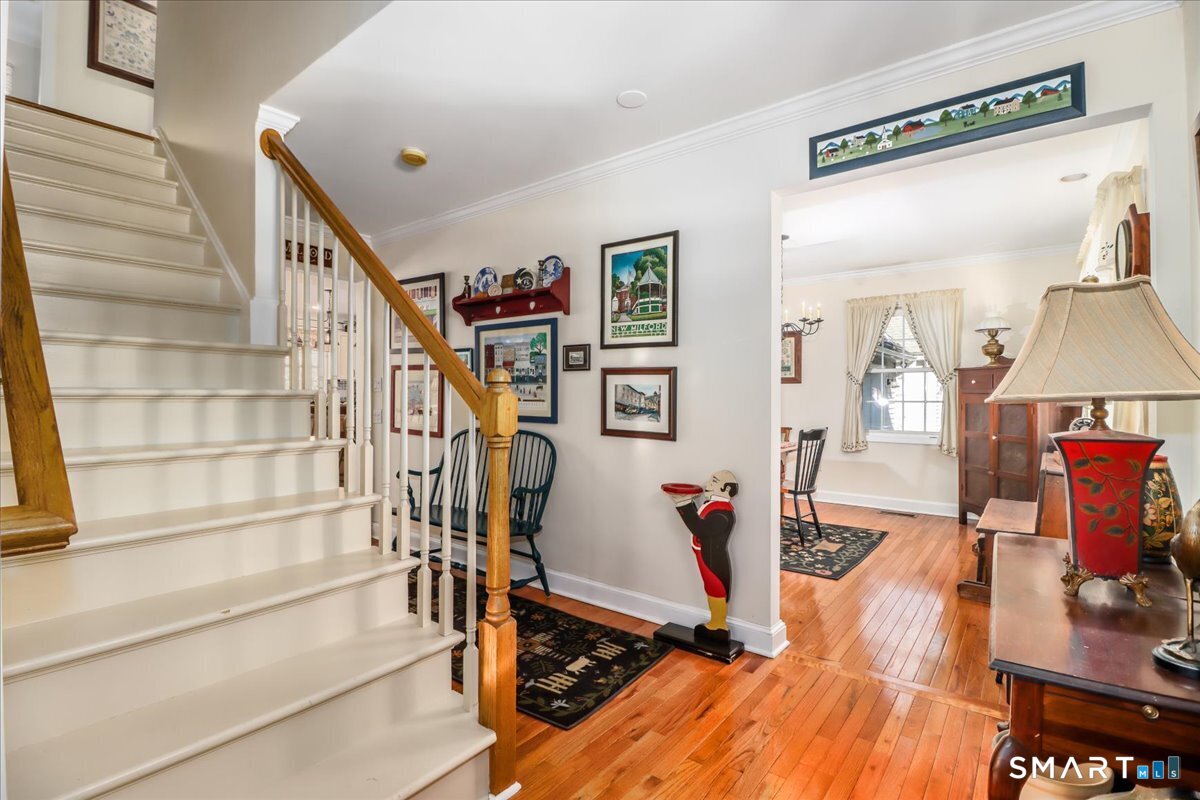 a view of a room with wooden floor and windows