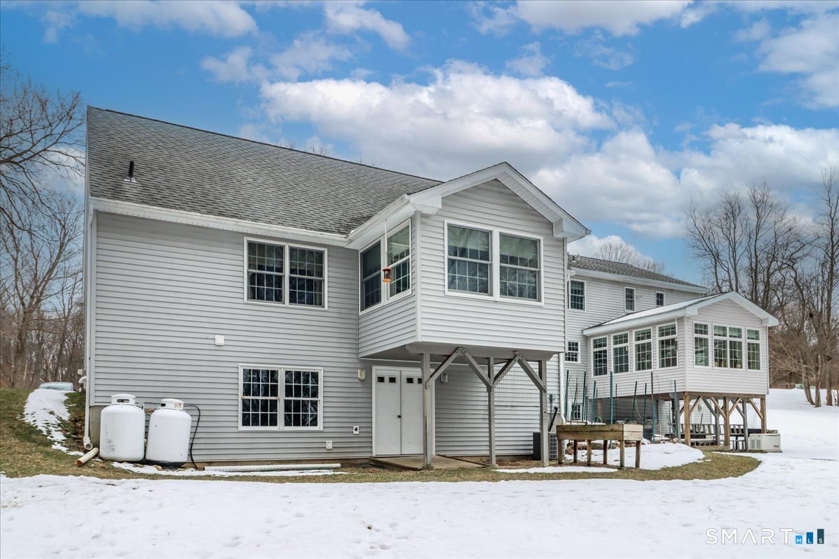 55 Washington Ridge Road New Milford, CT 06776 - Photo 11 of 40 a front view of a house with a yard