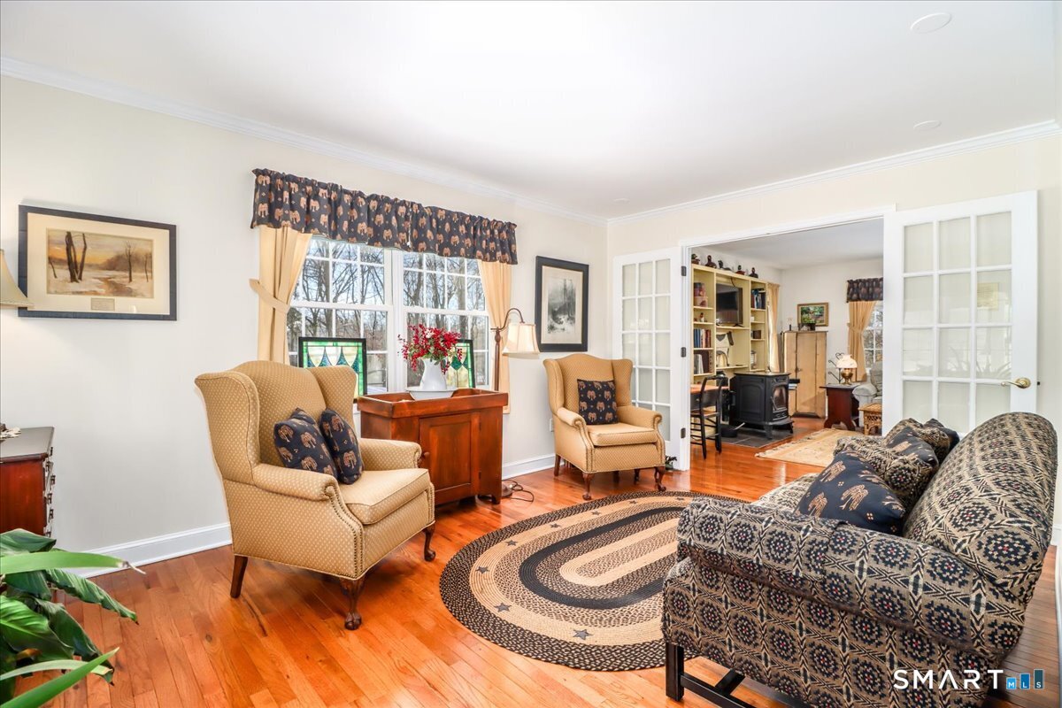 55 Washington Ridge Road New Milford, CT 06776 - Photo 2 of 40 a living room with furniture and a large window