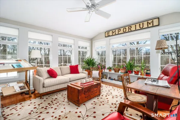 a living room with furniture and a window