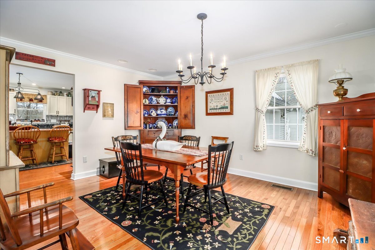 55 Washington Ridge Road New Milford, CT 06776 - Photo 26 of 40 a view of a dining room with furniture and wooden floor