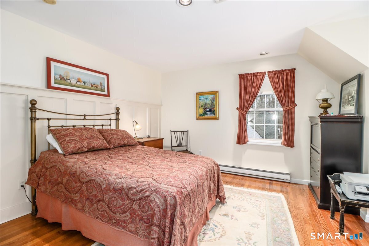 55 Washington Ridge Road New Milford, CT 06776 - Photo 31 of 40 a bedroom with a bed and a flat screen tv